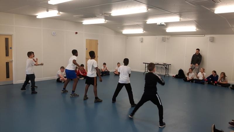 A group of people taking a dance class