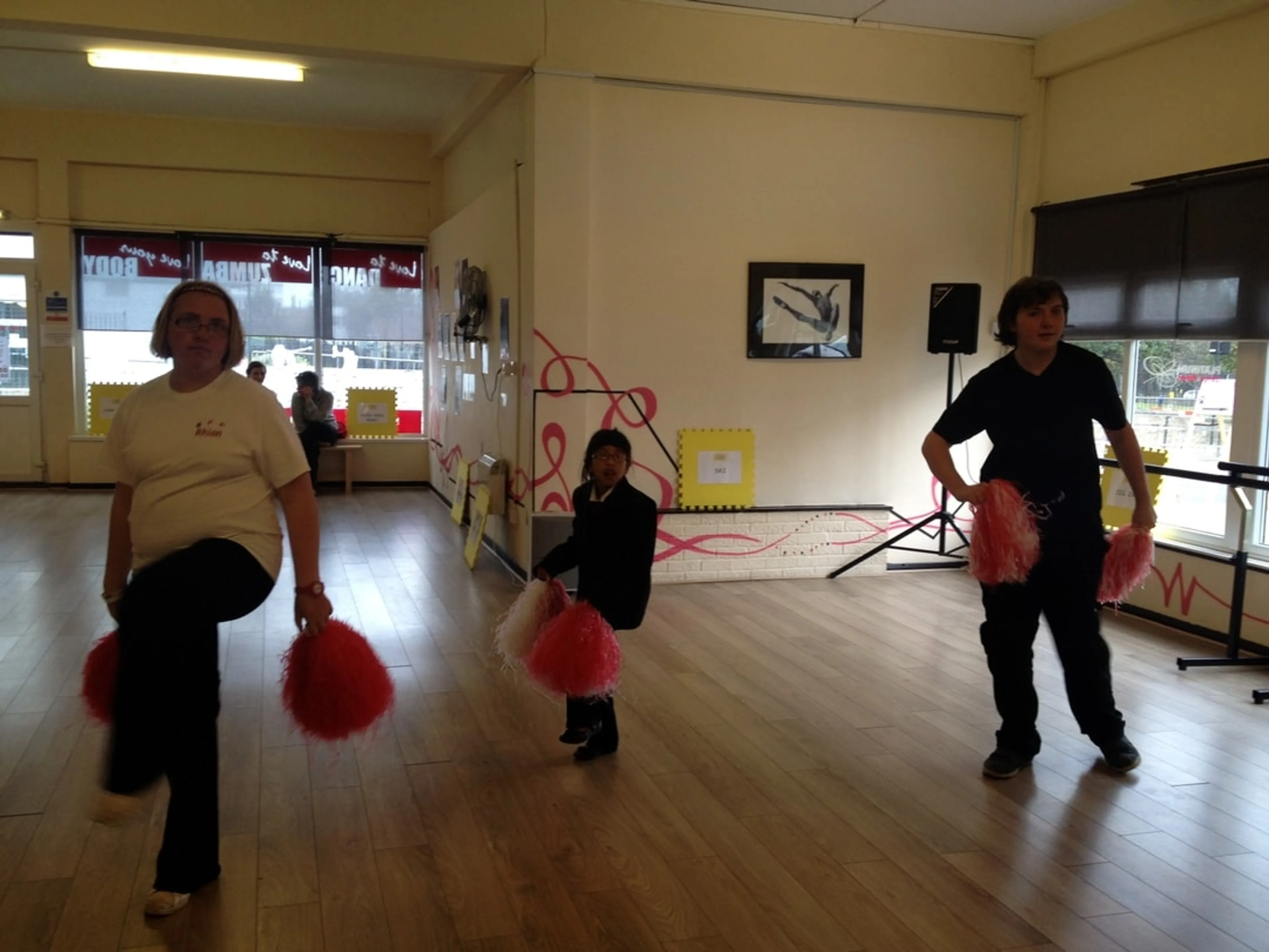 Adults and kid in a dance studio