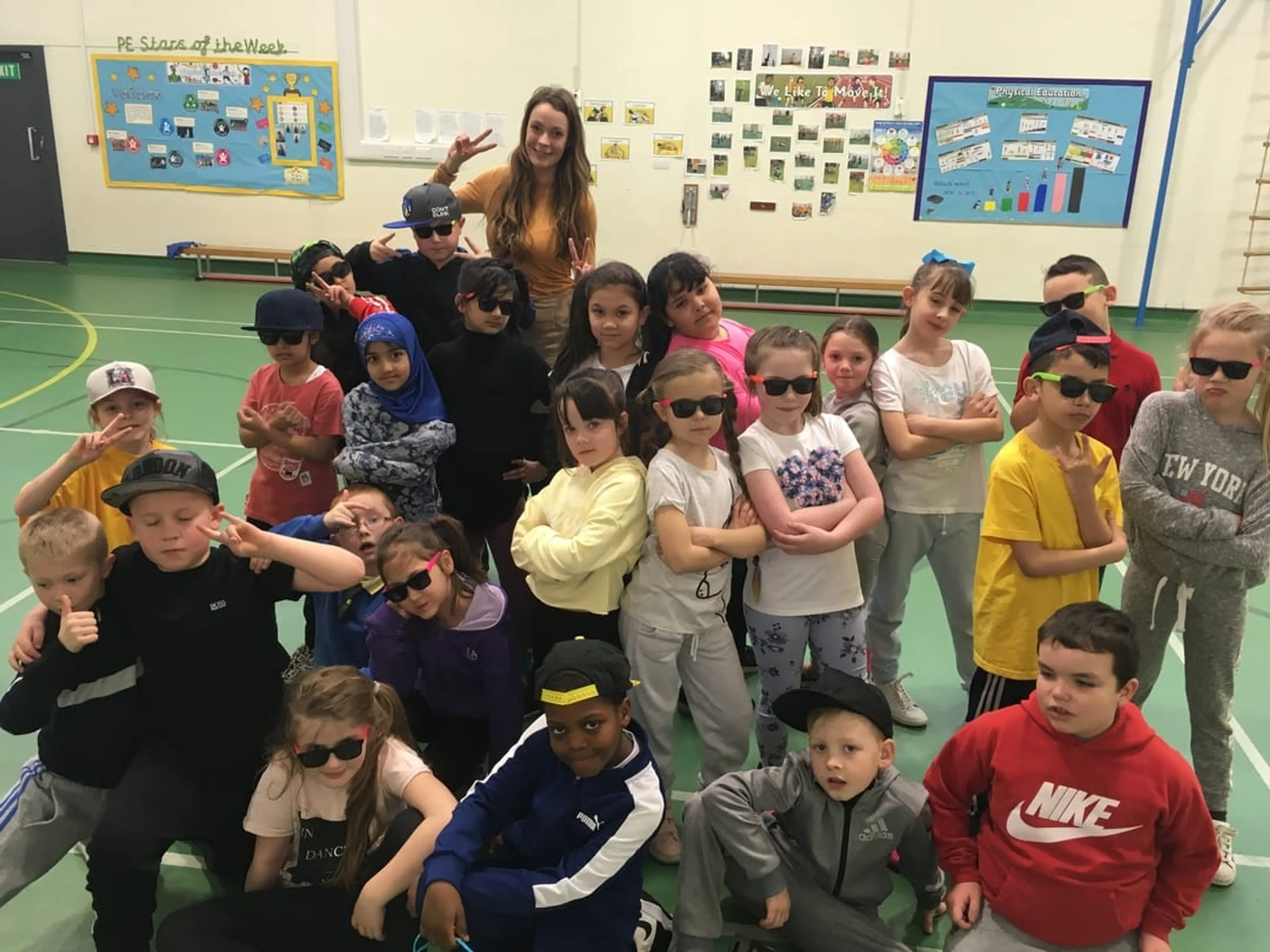 A group of kids posing for the camera in fancy dress