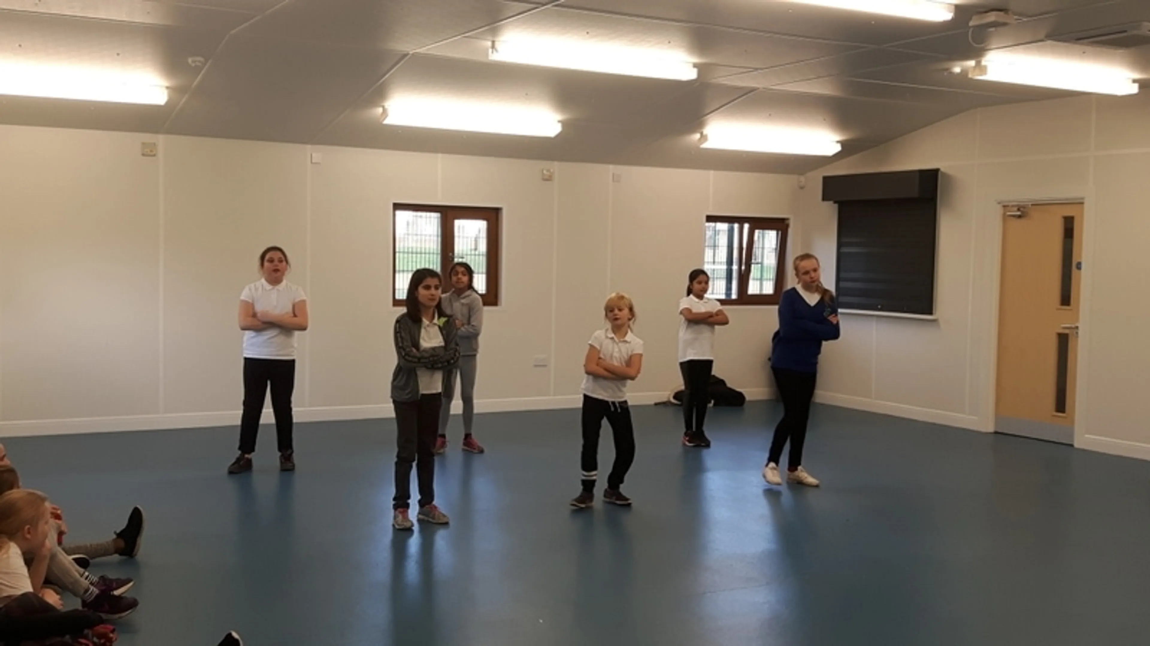 A group of people taking a dance class
