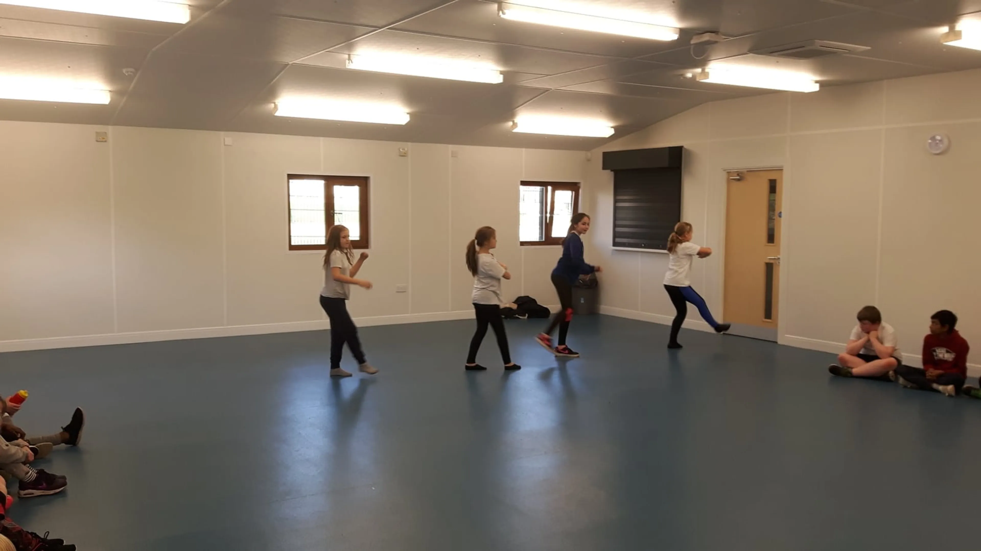 A group of people taking a dance class