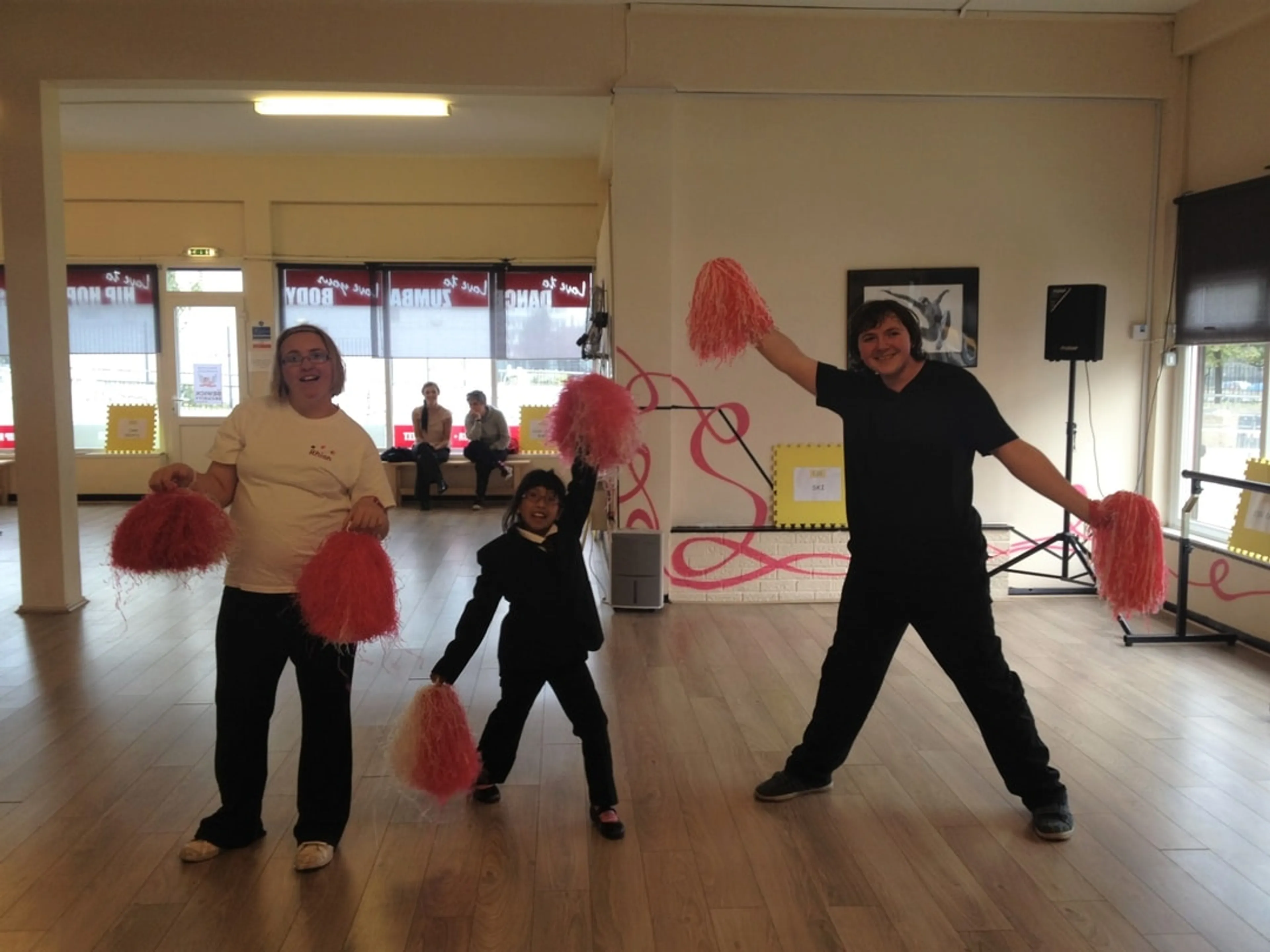 Adults and kid in a dance studio